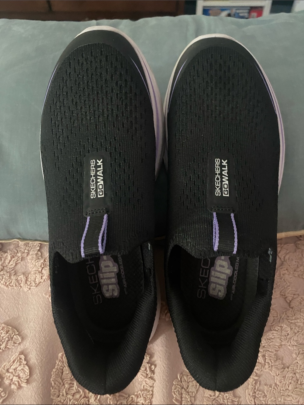Skechers GOwalk Women’s Black Slip-On Sneakers with Purple Accents